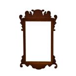 A 19th century George II-style mahogany fretwork mirror, 26½ x 15¾in. (67.3 x 40cm.).