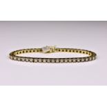A 14ct yellow gold and diamond tennis bracelet, featuring 49 round cut diamonds totalling