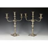 A pair of Edwardian George II-style silver three light candelabra, Thomas Bradbury & Sons, London