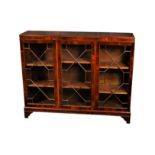 A Georgian style mahogany low glazed bookcase, the moulded top over three 13 pane astragal glazed