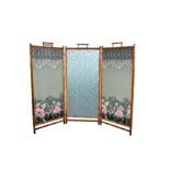 An Oriental style three fold bamboo screen / room divider, 1920s-30s, with later silk panels in a