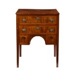 An early 19th century French style dressing table, the rectangular top over two long cross banded