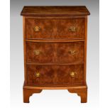 A 1930s the walnut three drawer chest, of small proportions, with reeded edge top, raised on