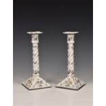 A pair of late 18th / early 19th century enamel candlesticks, of spiral moulded form, rising to