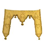 A Victorian yellow silk and velvet country house curtain pelmet panel, in the Medieval revival