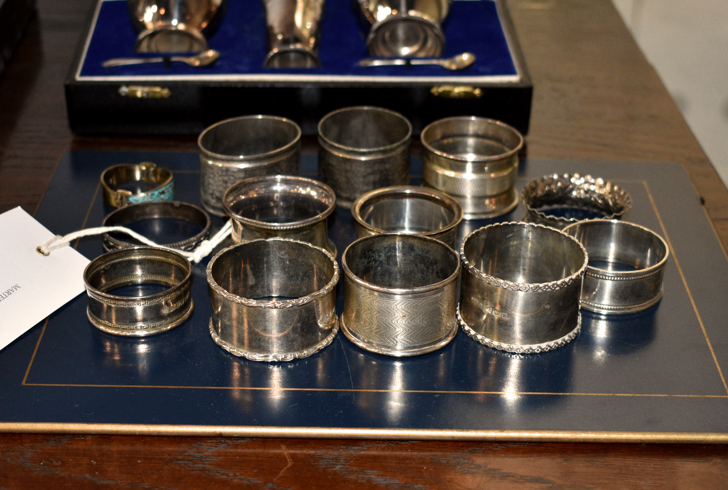 A small group of silver and white metal napkin rings, various dates, sizes and makers, gross