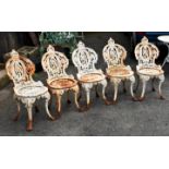 A set of five Victorian Coalbrookdale style cast iron garden chairs, c.1880, the curved foliate