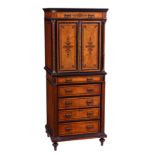 A late Victorian ebonised and burr amboyna cabinet in the manner of Edwards and Roberts, the ebony