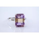A 9ct and emerald cut ametrine cocktail ring, with diamond shoulders, the ametrine a light purple to