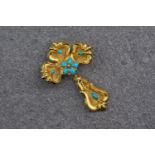A 22ct yellow gold and turquoise articulated cross, with ornate detailing to the corners of the