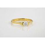 An 18ct yellow gold and brilliant cut diamond ring., The stone approximately 0.40ct and in a tension