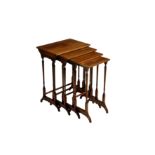 A quartetto nest of Edwardian boxwood strung mahogany tables, on slender turned column legs with