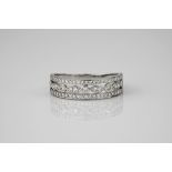A 9ct white gold and diamond 3 row half eternity ring, the top and bottom rows filled with pavé