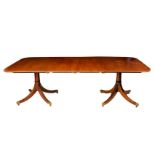 A George III style mahogany two pedestal dining table, 1st half 20th century, the two D-ends with