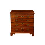 A George III mahogany bachelor's chest, with a brushing slide over four graduated drawers, the lower