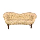 A Victorian serpentine two seater button back settee, reupholstered to a good standard, raised on