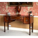 A late George III cross banded mahogany serpentine sideboard, attributed to Gillows, inlaid with