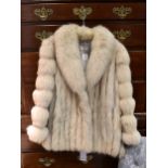 A silver fox fur short jacket, by 'Saga Fox', size 12-14.