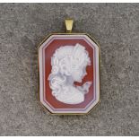 A 15ct yellow gold set glass cameo, octagonal in shape and featuring the profile of a young girl