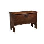 A 17th century oak six plank coffer, of small proportions, the top on original hinges (one loose),