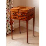 A Regency satinwood and mahogany writing table, the two part hinged rectangular top with a shell