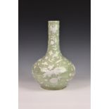 A Chinese celadon and white slip porcelain bottle vase, probably 19th century, the globular body