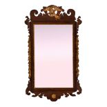 A 19th century George II style mahogany fretwork mirror, the rectangular plate within a parcel