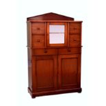 A Victorian mahogany part glazed side cabinet, the peaked back over a central glazed door flanked by