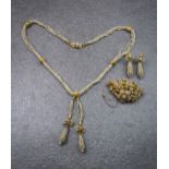 A Victorian gold and seed pearl brooch, necklace and earring suite, the necklace made up of