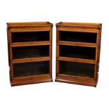 A pair of mid-oak Globe Wernicke-style three tier lawyer's bookcases, 1920s-30s, the flared tops