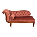 A small, late Regency mahogany metamorphic chaise longue, with reeded frame and buttoned upholstery,