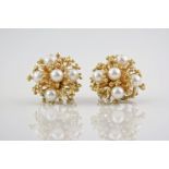 A pair of 1970s pearl cluster earrings, each with 5mm diameter pearls set into 9ct yellow gold