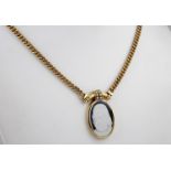 An 18ct yellow gold chain with diamond set glass cameo pendant, the heavy curb link chain supporting