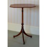 A George III mahogany lamp table, the octagonal fixed top on a slender turned and spiral fluted