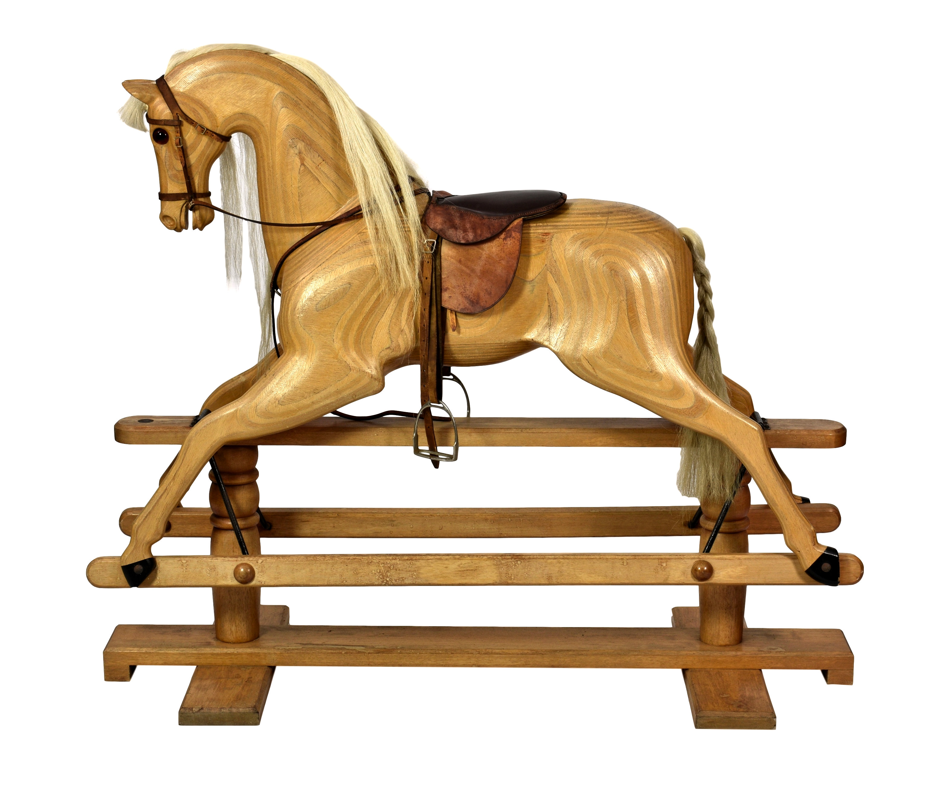 A Relko wooden rocking horse by Cookham Dean of England, with glass eyes, horse hair mane and tail