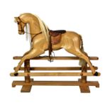 A Relko wooden rocking horse by Cookham Dean of England, with glass eyes, horse hair mane and tail