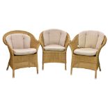 A set of three faux-rattan conservatory or garden chairs, by Cane-Line, together with a similar