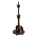An Anglo-Indian carved hardwood lamp standard, c.1900, the turned tapered column carved with flowers