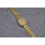 An 18ct yellow gold and diamond Omega ladies wristwatch, the 11mm. gilt octagonal dial with sword