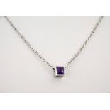 A Gucci 18ct white gold and amethyst pendant and matching stud earrings, the square cut amethysts