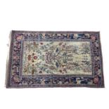 A Persian part silk tree design rug, probably 19th century, the central buff field decorated with