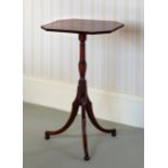 A George III mahogany tilt-top tripod table, the octagonal top with boxwood lines and reeded edge,