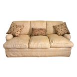 A three seater Howard Chairs Ltd. style three seater sofa, fourth quarter 20th century, with 'Howard