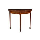 A Continental early 19th century mahogany demi-lune card table, the baize lined and feather banded