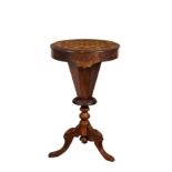 A Victorian walnut and parquetry trumpet games and work table, the circular top with parquetry games