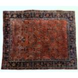 An antique Persian carpet, probably 19th or early 20th century, with all over floral, vase and