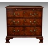 A George III style mahogany bachelors chest, adapted, the moulded top over a brushing slide and