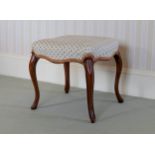 A 19th century walnut French Hepplewhite style stool, with serpentine rectangular seat and