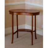 An Edwardian walnut kidney shaped occasional table, the strung top raised on square tapered legs