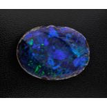 A loose, unmounted black opal doublet, oval, 36 x 21mm., with good kingfisher blue, dark blue, green